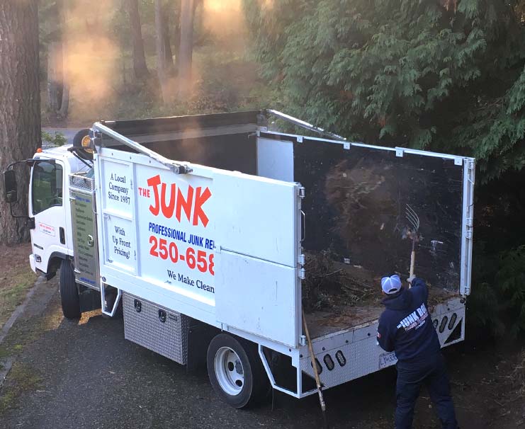 Loading yard waste into back of truck